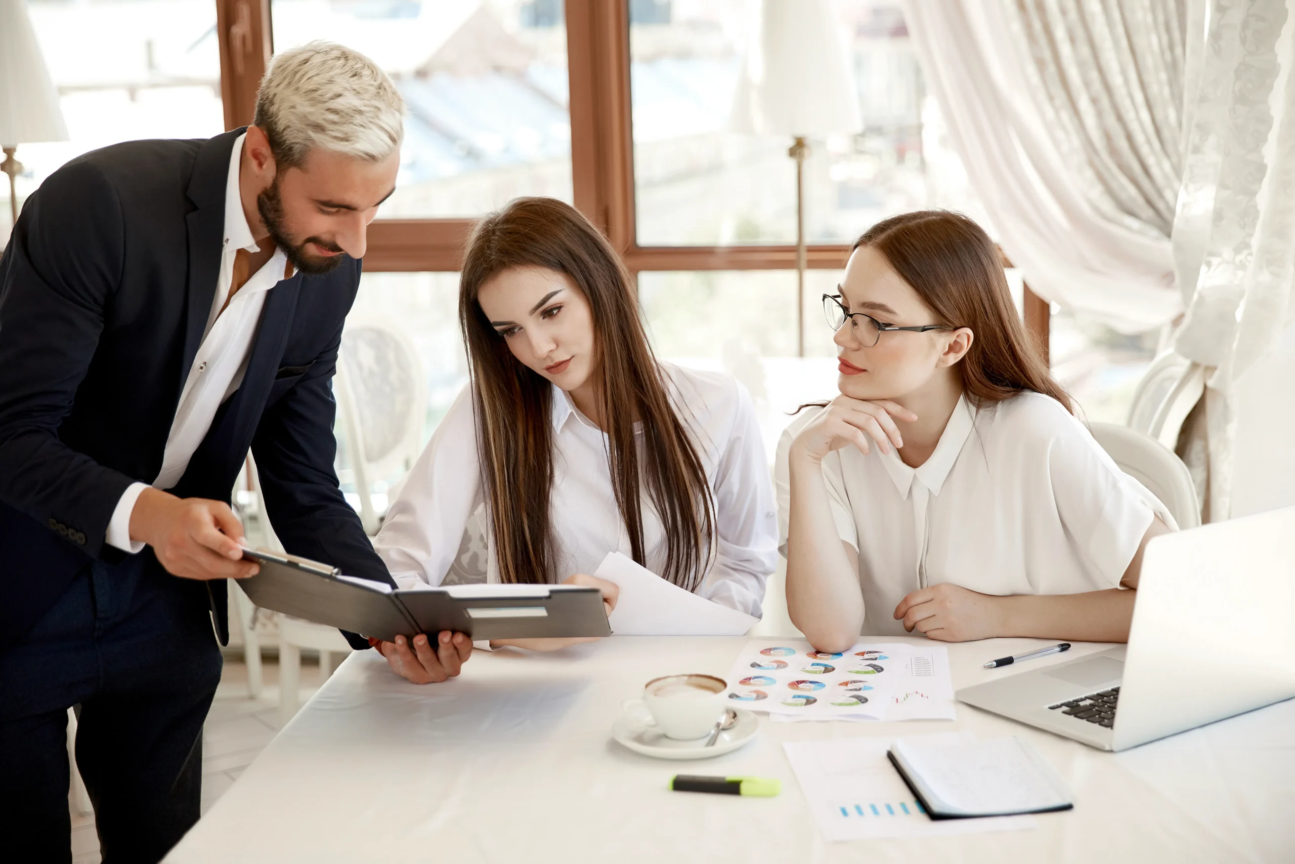 young-coworkers-are-discussing-annual-financial-reports-diagrams